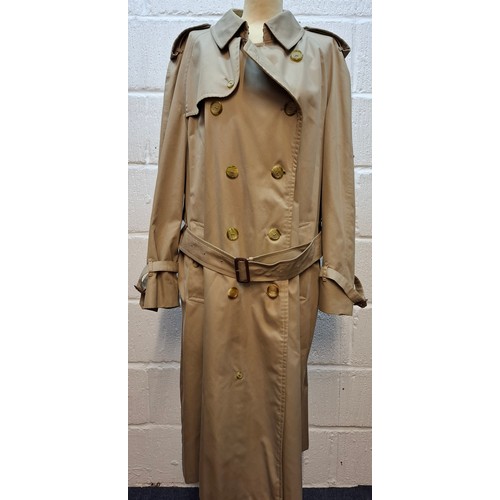 7 - Burberrys- A late 20th Century gents beige Kensington trench coat with bone effect buttons, double b... 