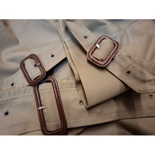 7 - Burberrys- A late 20th Century gents beige Kensington trench coat with bone effect buttons, double b... 