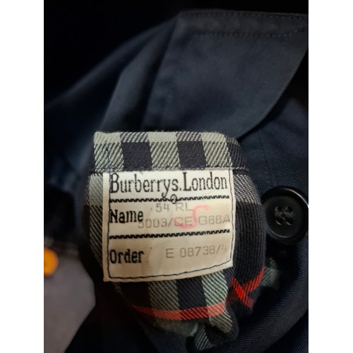 9 - Burberrys- A late 20th Century gents navy Kensington trench coat with navy buttons, double breasted,... 