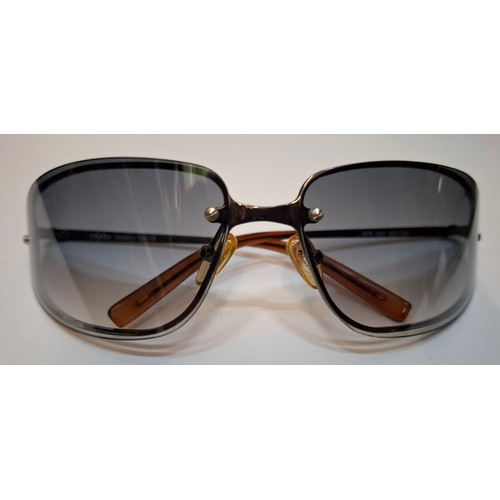 11 - Prada- 2 pairs of sunglasses, serial numbers 1AP-301 and 5AV-701 with black branded cases. Location:... 