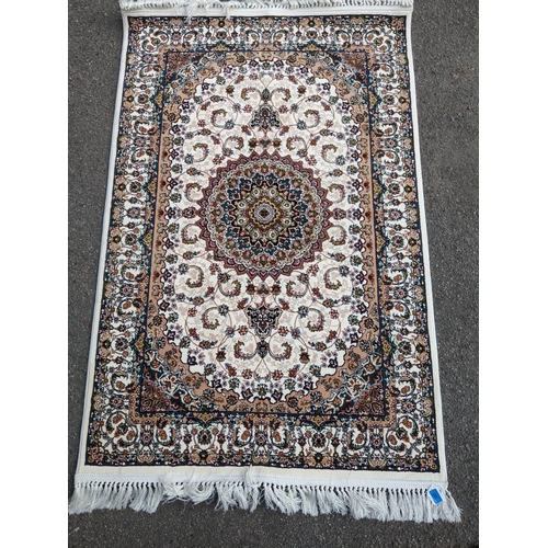 598 - A small contemporary Persian machine woven polyester filament rug, central floral medallion, with al... 