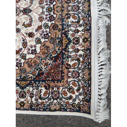 598 - A small contemporary Persian machine woven polyester filament rug, central floral medallion, with al... 