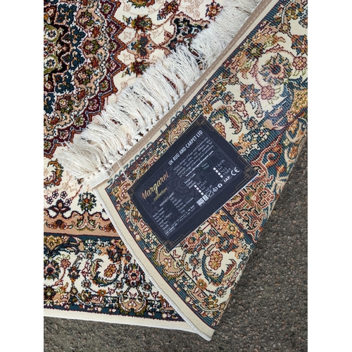 598 - A small contemporary Persian machine woven polyester filament rug, central floral medallion, with al... 