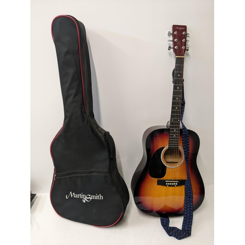 406 - A Martin Smith acoustic guitar in its original case, model no. W-500-SB-LH-PK Location: RWM
If there... 
