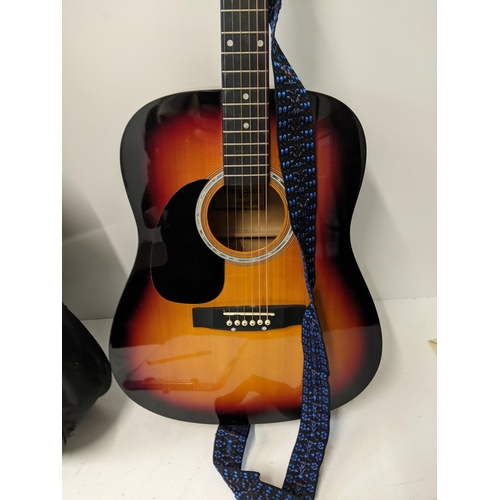 406 - A Martin Smith acoustic guitar in its original case, model no. W-500-SB-LH-PK Location: RWM
If there... 