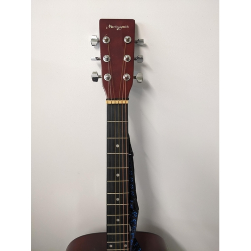 406 - A Martin Smith acoustic guitar in its original case, model no. W-500-SB-LH-PK Location: RWM
If there... 