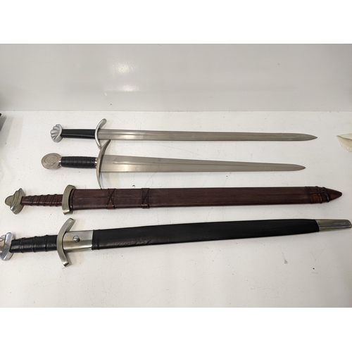 407 - Four reproduction blunt Saxon style swords, two with sheaths Location: A3M
If there is no condition ... 