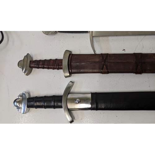 407 - Four reproduction blunt Saxon style swords, two with sheaths Location: A3M
If there is no condition ... 