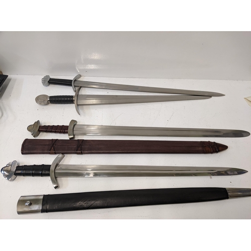 407 - Four reproduction blunt Saxon style swords, two with sheaths Location: A3M
If there is no condition ... 