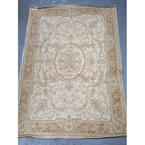 575 - A Laura Ashley Home floral pattern rug, beige with red highlights on a cream ground 188cm x 134cm Lo... 