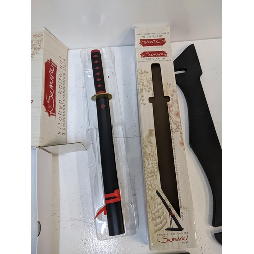 579 - A Samurai novelty kitchen knife set with original box, along with a boxed Samurai style chef's knife... 