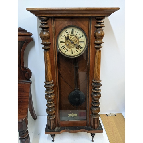 591 - A Victorian mahogany hall chair with an ornately carved back, and a walnut and beech late 19th centu... 