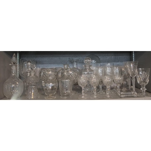 85 - A collection of mainly crystalware drinking glasses, decanters and a glass dome

Location: 5.2
If th... 