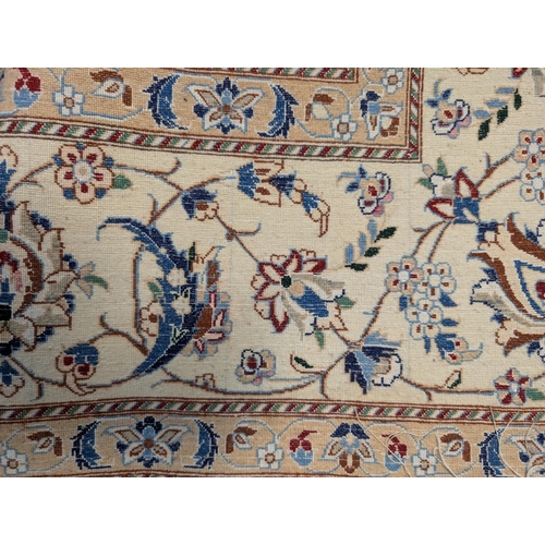 47 - A central Persian rug with a central medallion and entwined vines, on a blue and cream ground, 152cm... 