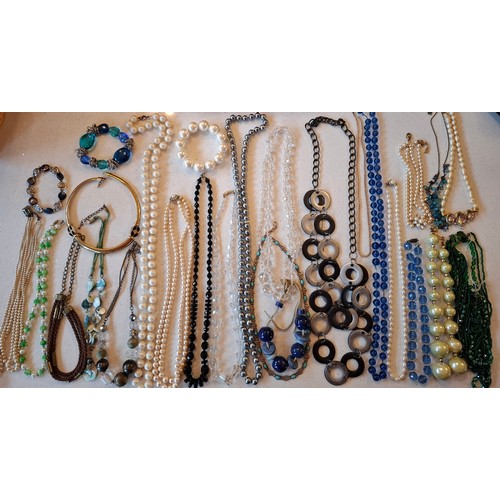 72 - A quantity of costume jewellery to include a silver and turquoise cabochon necklace stamped 925, 2 v... 