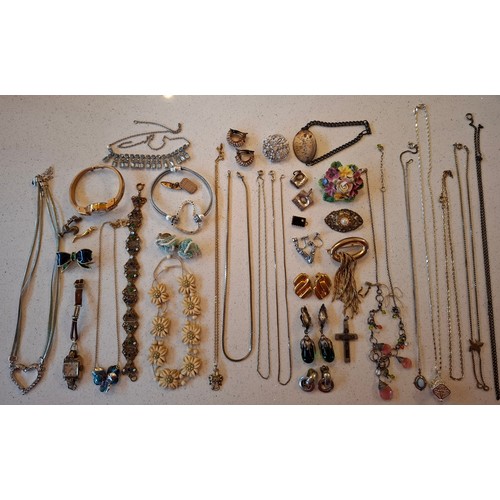 72 - A quantity of costume jewellery to include a silver and turquoise cabochon necklace stamped 925, 2 v... 