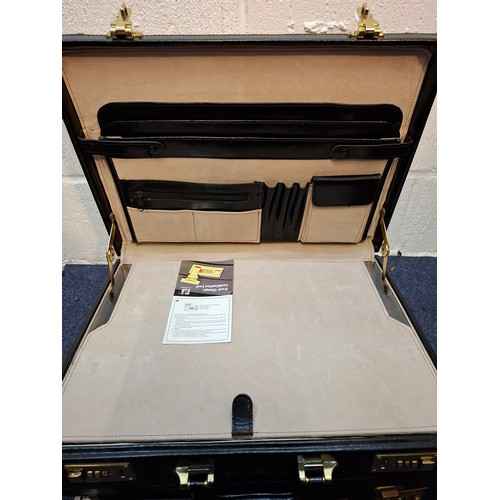 25 - Two black briefcases to include a Dunhill example with combination lock and metal corners. Location:... 