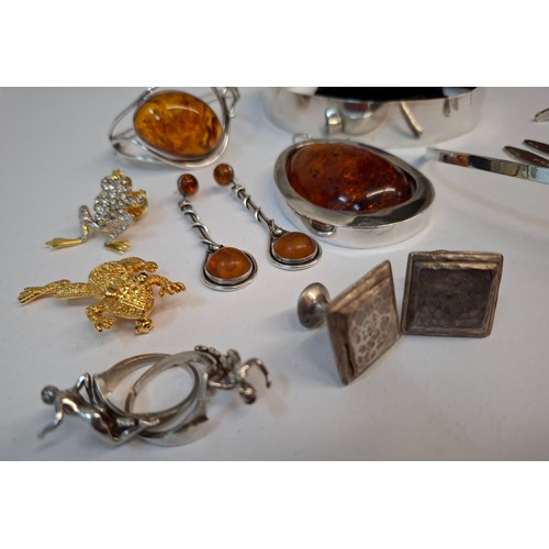 26 - A quantity of white metal, silver, amber coloured and other jewellery all housed in a treen jeweller... 