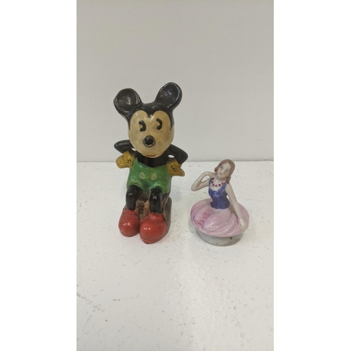 339 - A 1930's/40's pottery example of Mickey Mouse together with a porcelain half doll tea cosy
Location:... 