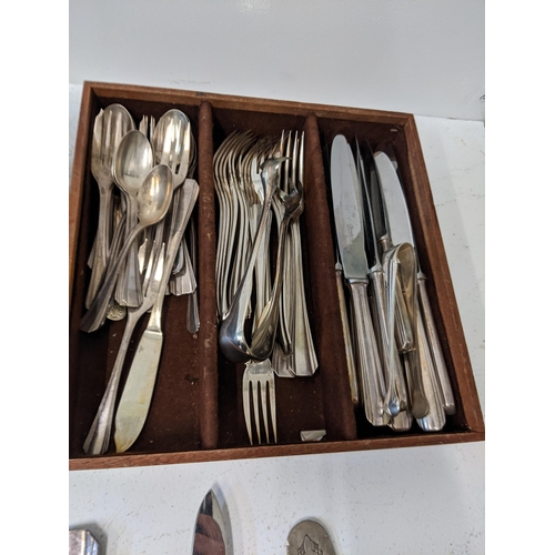 417 - A collection of silver plated flatware t include cake knives, cake forks, a mother of pearl handled ... 