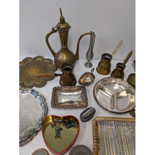 418 - A collection of brass and silver plated items to include a middle eastern coffee pot, a silver plate... 