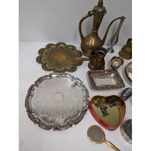 418 - A collection of brass and silver plated items to include a middle eastern coffee pot, a silver plate... 