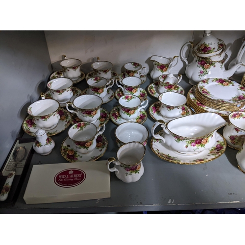 420 - A Royal Albert old country roses pattern dinner service to include plates, lidded tureens and other ... 