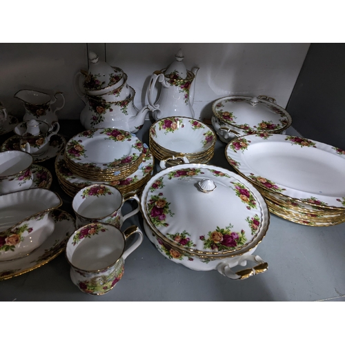 420 - A Royal Albert old country roses pattern dinner service to include plates, lidded tureens and other ... 