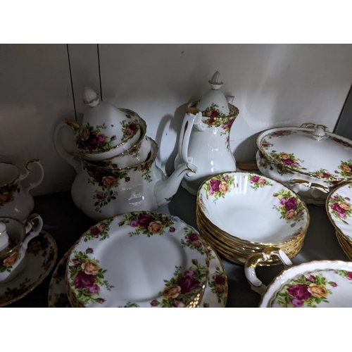 420 - A Royal Albert old country roses pattern dinner service to include plates, lidded tureens and other ... 