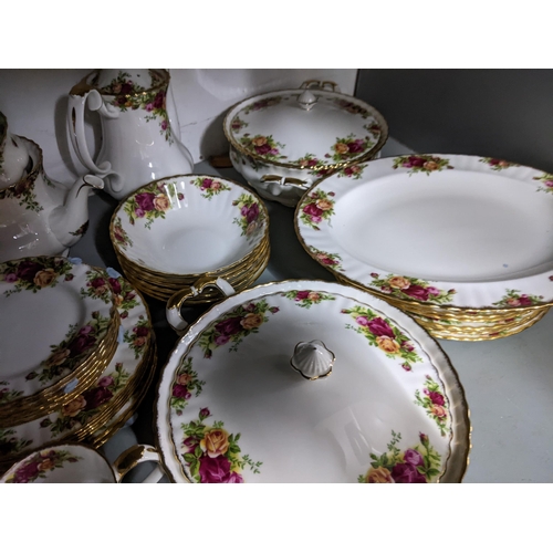 420 - A Royal Albert old country roses pattern dinner service to include plates, lidded tureens and other ... 