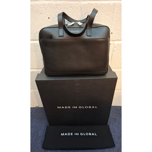 19 - Made In Global-A black grained leather small travel bag, approx 16