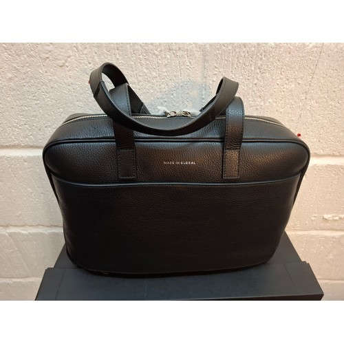 19 - Made In Global-A black grained leather small travel bag, approx 16