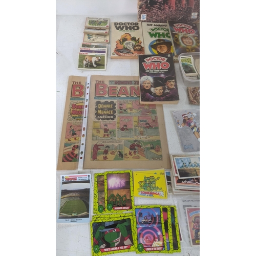 429 - A mixed lot of ephemera to include a collection of mostly filled cigarette card books, with loose ex... 