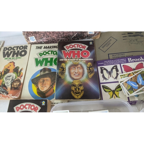 429 - A mixed lot of ephemera to include a collection of mostly filled cigarette card books, with loose ex... 