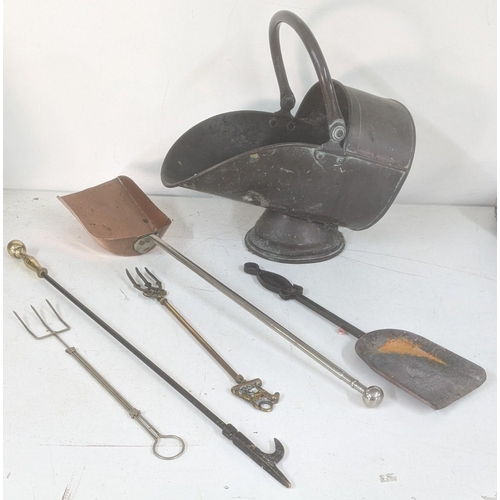 432 - Fireside items to include a Victorian copper coal scuttle, toast forks together with a steel and cop... 