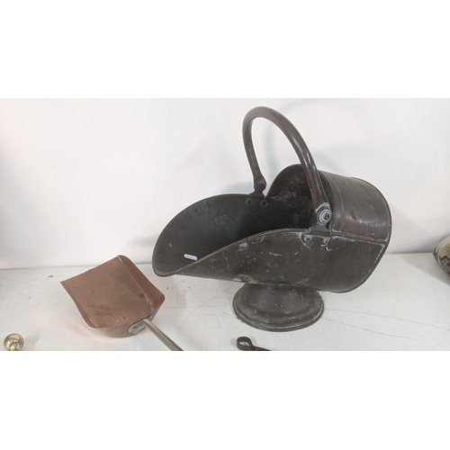 432 - Fireside items to include a Victorian copper coal scuttle, toast forks together with a steel and cop... 