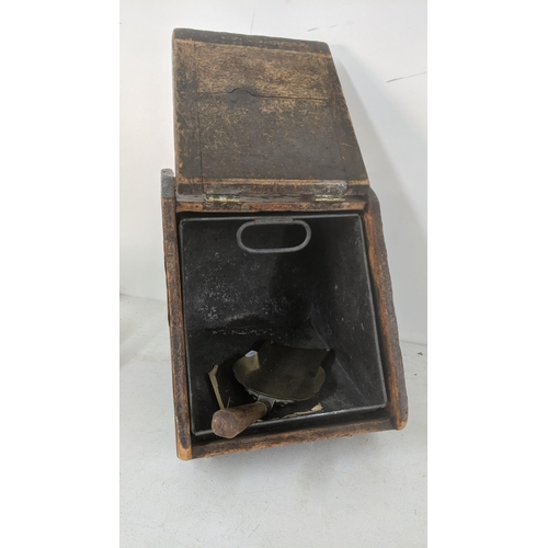 433 - A Victorian Arts & Crafts coal scuttle having brass hinges and handle together with a shovel
Locatio... 