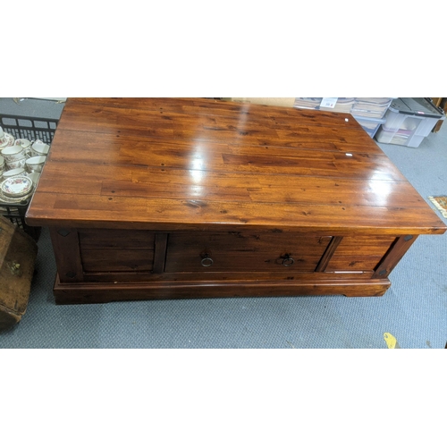 437 - A Mango wood coffee table having two drawers, 125cm x 79cm, 40cm high
Location: RAM
If there is no c... 