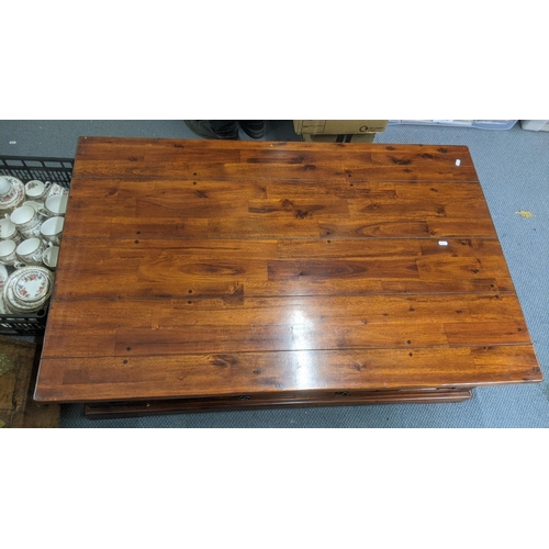 437 - A Mango wood coffee table having two drawers, 125cm x 79cm, 40cm high
Location: RAM
If there is no c... 