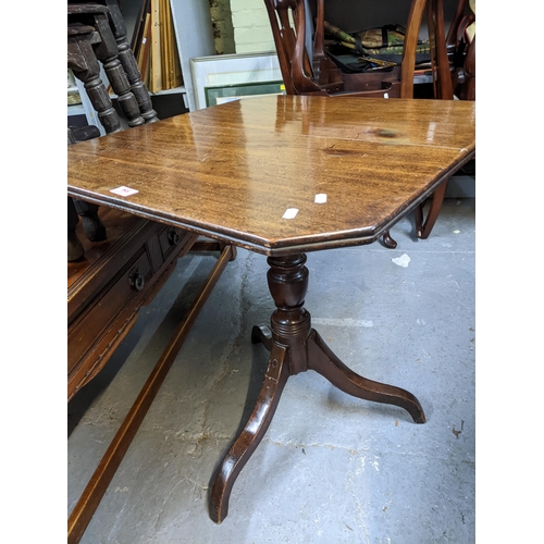 554 - A Georgian mahogany tilt topped occasional table on turned column and tripod legs, 72cm high, 69.5cm... 