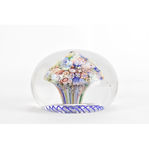 10A - A Victorian Baccarat close-packed millefiori mushroom glass paperweight circa 1850, with a series of... 