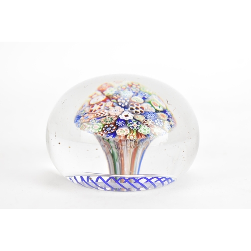 10A - A Victorian Baccarat close-packed millefiori mushroom glass paperweight circa 1850, with a series of... 