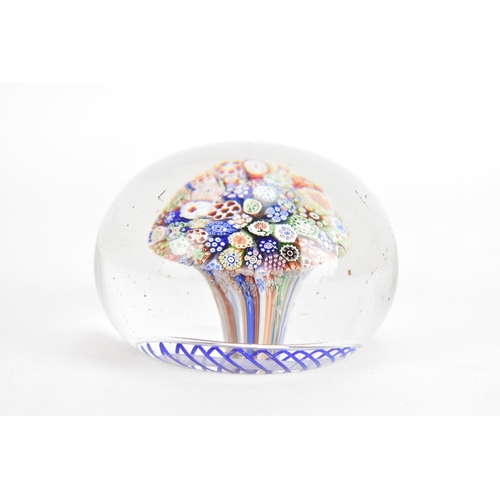 10A - A Victorian Baccarat close-packed millefiori mushroom glass paperweight circa 1850, with a series of... 