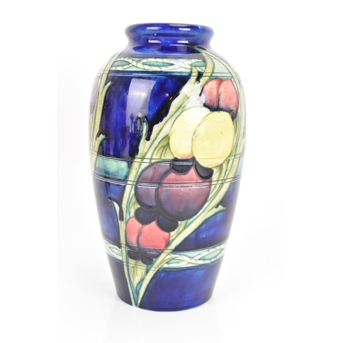 11 - A Moorcroft vase, circa 1947-53, in the 'Banded Wisteria' pattern, of ovoid form with coloured flowe... 