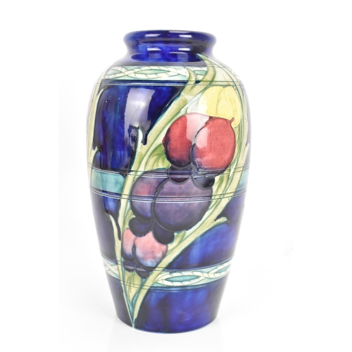 11 - A Moorcroft vase, circa 1947-53, in the 'Banded Wisteria' pattern, of ovoid form with coloured flowe... 