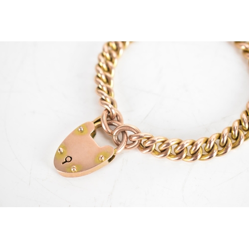 115A - A 9ct gold curb chain link bracelet with a heart shaped padlock clasp, stamped 9ct, 15.1 grams
If th... 