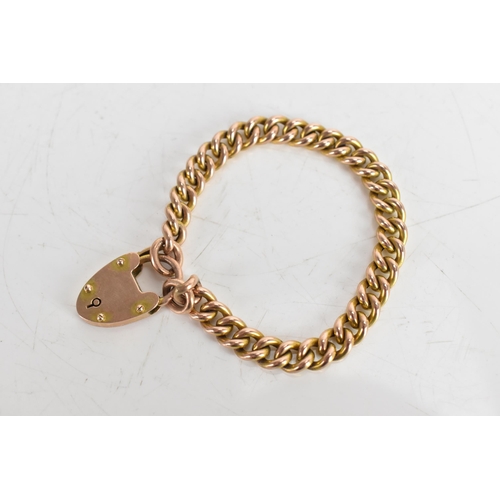 115A - A 9ct gold curb chain link bracelet with a heart shaped padlock clasp, stamped 9ct, 15.1 grams
If th... 