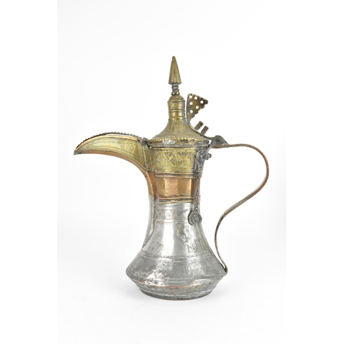 119 - An 18th/19th century silvered copper and brass Dallah coffee pot, having a tapering finial and pierc... 