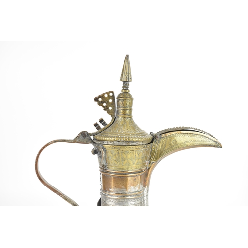 119 - An 18th/19th century silvered copper and brass Dallah coffee pot, having a tapering finial and pierc... 