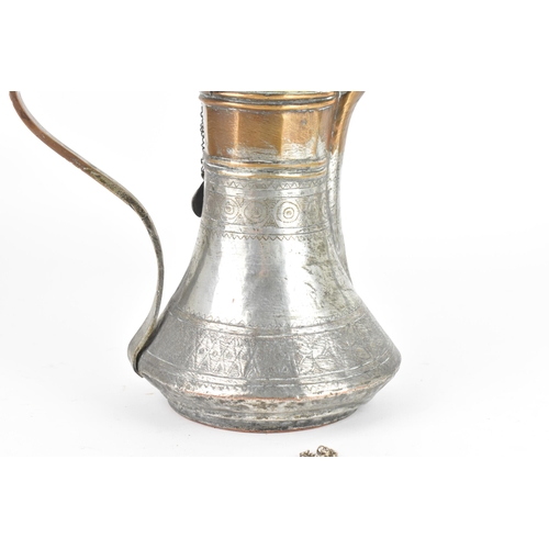 119 - An 18th/19th century silvered copper and brass Dallah coffee pot, having a tapering finial and pierc... 